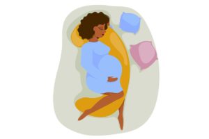 illustration of pregnant woman sleeping on mattress with topper and pillows