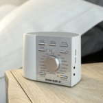 Image of the Adaptive Sound Technologies Sound + Sleep SE Premium Sound Machine on a bedroom counter
